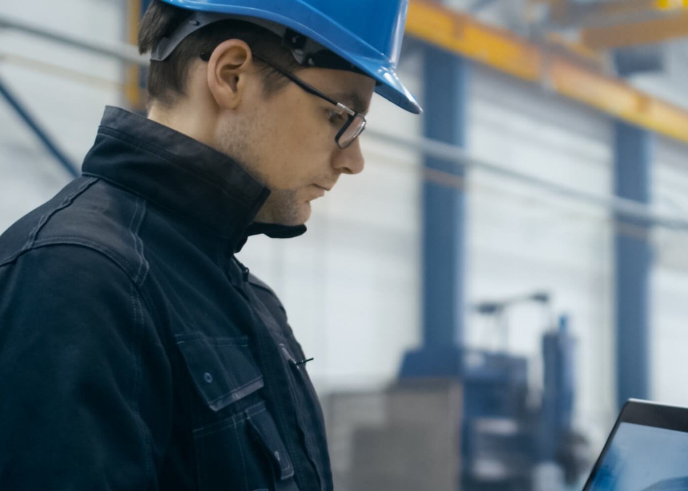 warehouse employee working on laptop