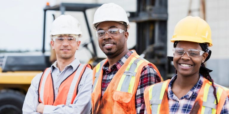construction crew on site smiling